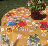 Round Tan Mums Oilcloth Tablecloth with Green Bias Tape trim
