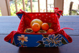 Reversible Oilcloth Basket in Blue Hibiscus and White on Red Polka Dot