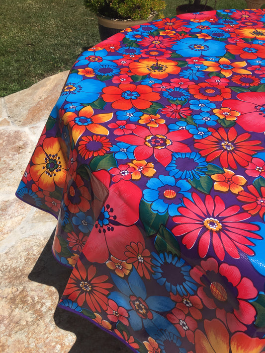 Round Purple Flora Oilcloth Tablecloths with Orange Bias Tape Trim